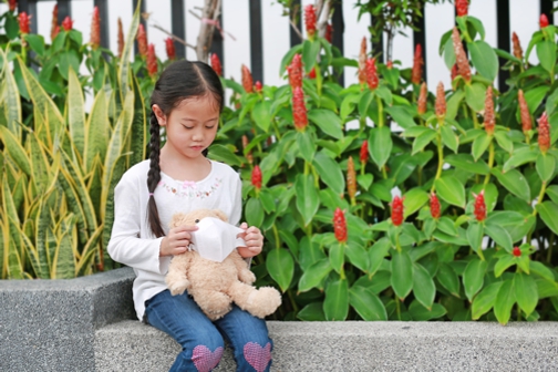 asian child with a teddy bear